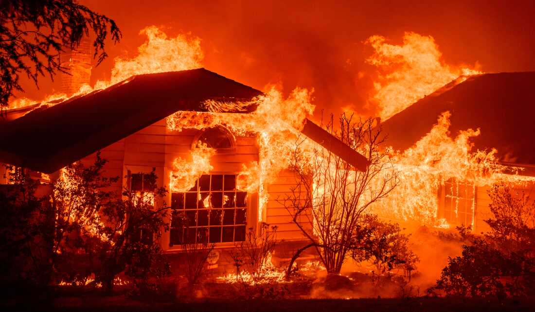 An Altadena home engulfed in flames during the Eaton Fire in January 2025